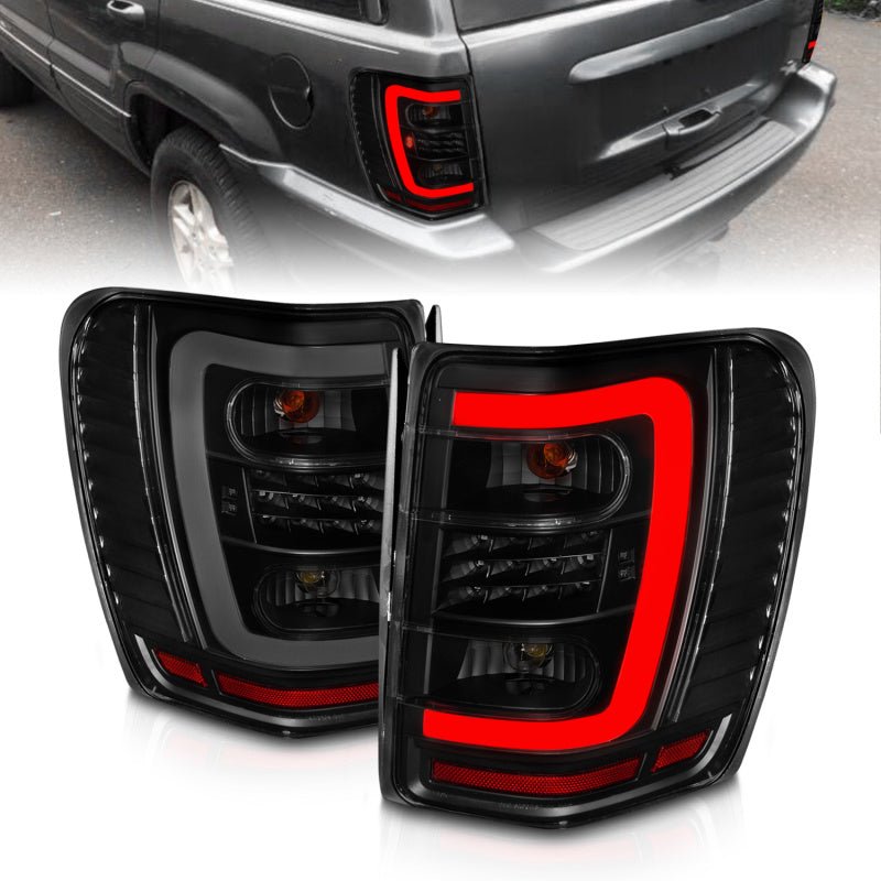 ANZO 1999 - 2004 Jeep Grand Cherokee LED Tail Lights w/ Light Bar Black Housing Smoke Lens - R70オートパーツ【公式】